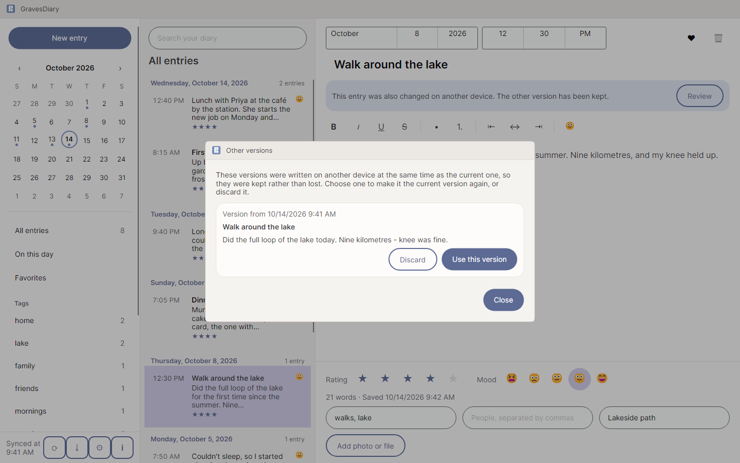An entry that was changed on two computers, with a notice that both versions were kept and a Review button.